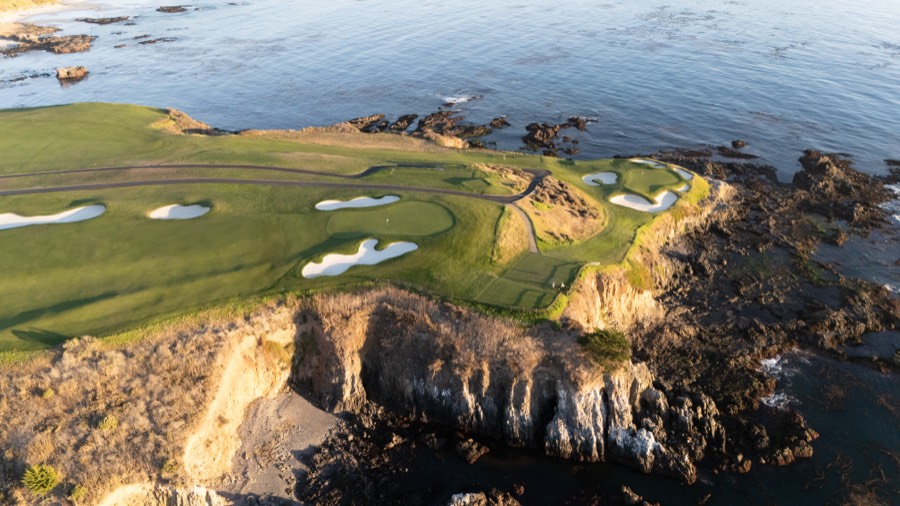 Clifftop golf hole above the ocean, from the air