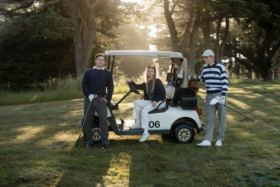 Friends riding in a golf cart